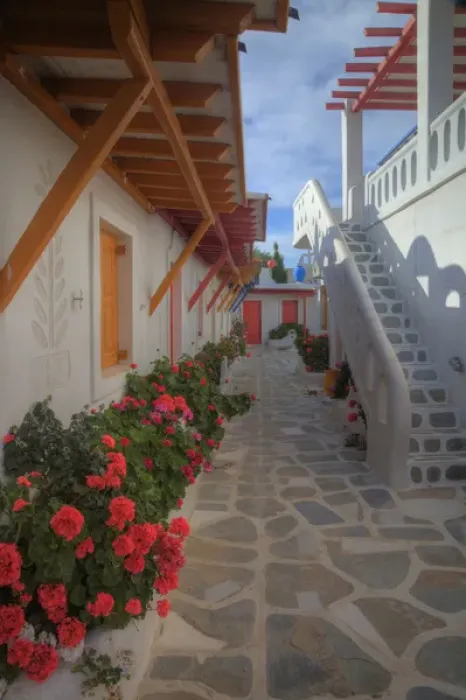 Framed Print : Europe, Greece, Greek Island, Mykonos, Color but old refurishing hotel in central