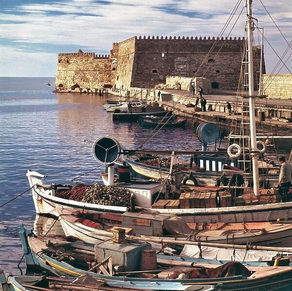 Europe, Greece, Iraklion. Fishing boats are moored at the old port near the Rossa