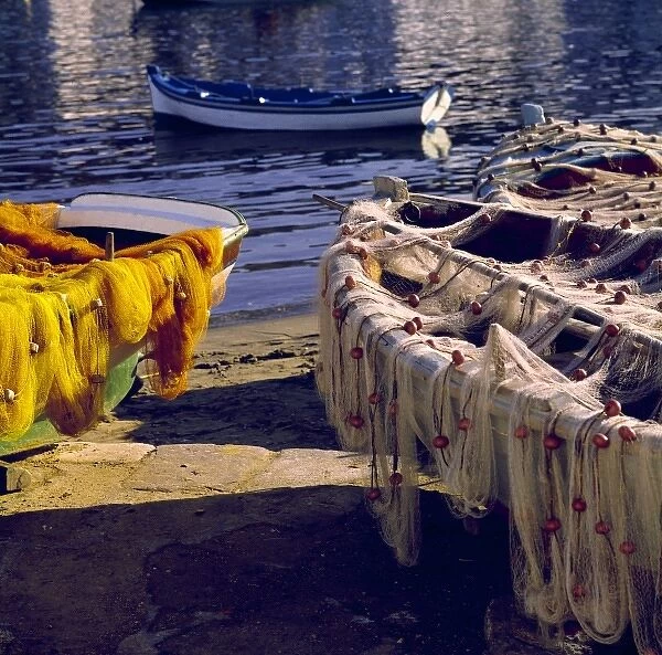 Europe, Greece, Mykonos. Nets draped over boats appear as fine-textured decoration in Mykonos