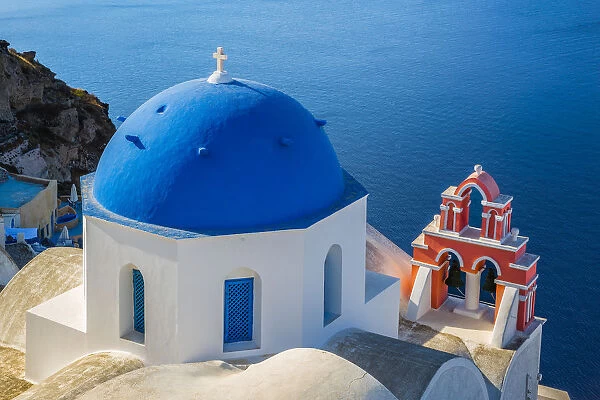 Europe, Greece, Oia. Greek Orthodox church and ocean