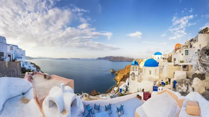 Framed Print : Europe, Greece, Oia. Panorama of coastal town
