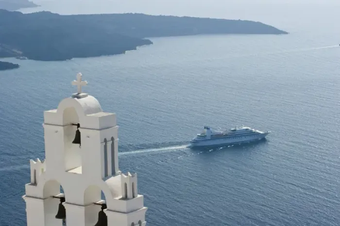 Framed Print : Europe, Greece, Santorini. Blue church dome and white bell tower overlooking a luxury yacht