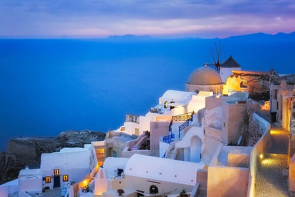 Europe, Greece, Santorini, Oia. Sunset on coastal town
