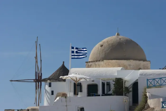 Framed Print : Europe, Greece, Santorini, Thira, Oia. Windmill and church dome with a Greek flag flying Framed Print : Europe, Greece, Santorini, Thira, Oia. Windmill and church dome with a Greek flag flying