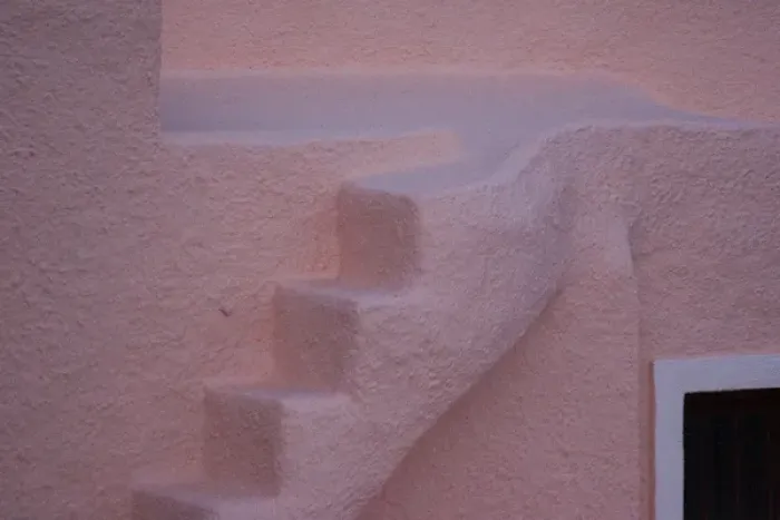 Framed Print : Europe, Greece, Santorini, Thira, Oia. Pink stucco wall and staircase. Credit as