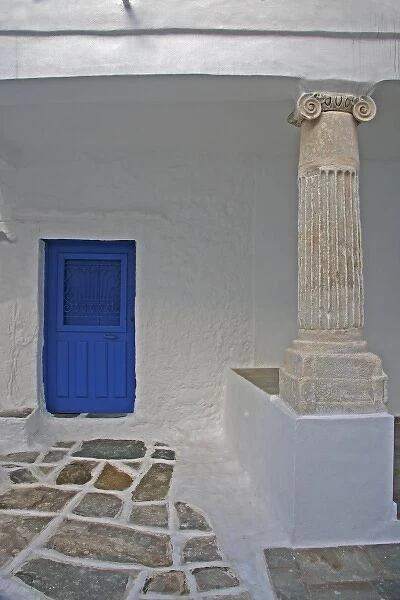Europe, Greece, Sifnos, Kastro. A ancient column is incorporated into a more recent home