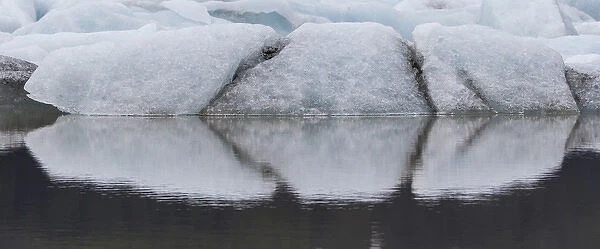 Europe, Iceland. Fjallsjokull Glacier reflects patterns in water