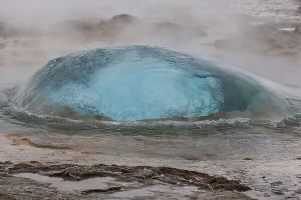 Europe, Iceland, Geysir Hot Springs. A Strokkur Geyser bubble just before it explodes