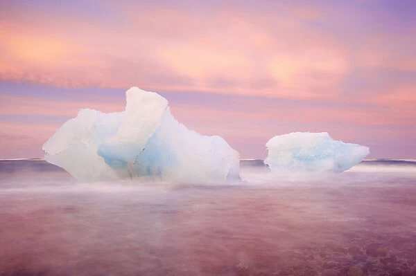 Europe, Iceland, Jokulsarlon Glacier Lagoon. Sunset on beached icebergs. Credit as