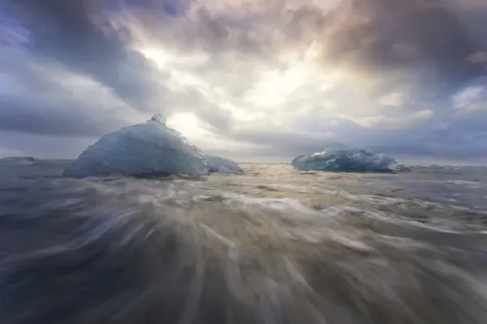 Framed Print : Europe, Iceland, Jokulsarlon Glacier Lagoon. Waves wash beached icebergs. Credit as