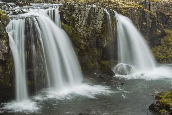 Europe, Iceland, Snaefellsnes. Waterfall flow from cliff