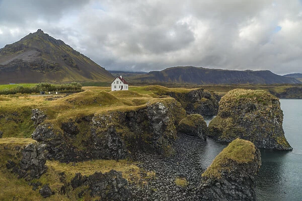 Europe, Iceland. View of the volcanic coastline of Arnarstapi on the Snaefellsnes