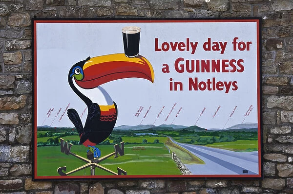 Europe, Ireland, Aghamore. Guinness sign outside Notleys pub. Credit as: Dennis