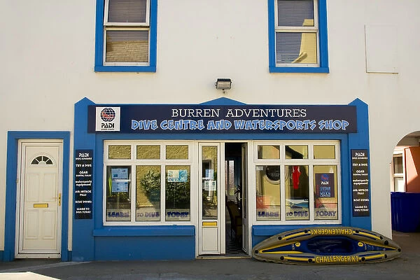 Europe, Ireland, Ballyvaughan. Store front of a dive center and watersports shop in the town center