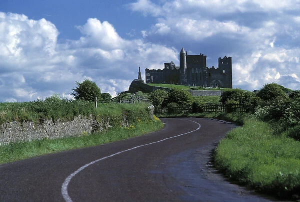 Europe, Ireland, Cashel. The stately Rock of Cashel stands darkly against a sky bright