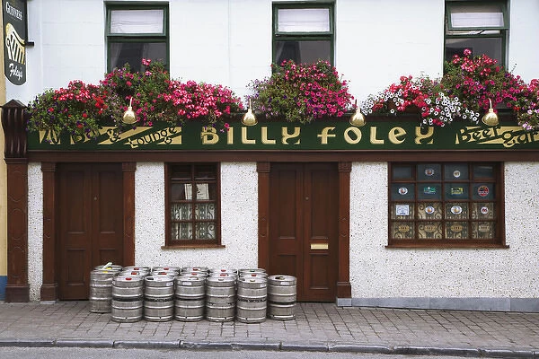 Europe, Ireland, County Tipperary. Beer barrels in front of Billy Foley pub. Credit as