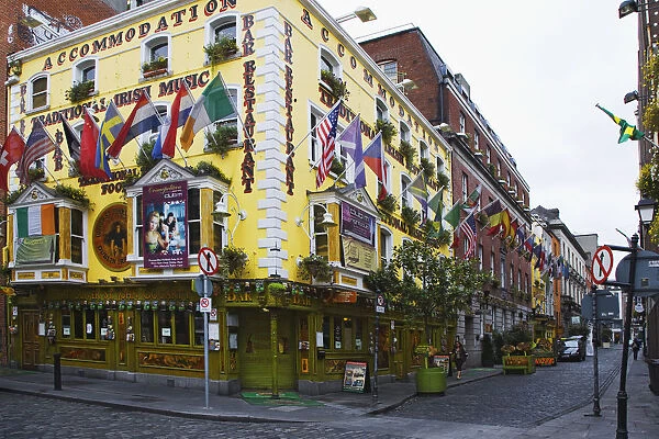 Europe, Ireland, Dublin. Flags and banners on Cogartys pub in Temple Bar District