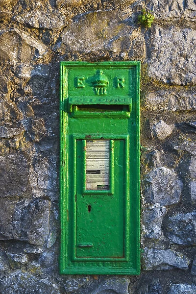 Europe, Ireland, Kilkenny. Green mail drop in stone wall. Credit as: Dennis Flaherty