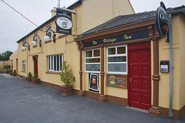 Europe, Ireland, Moyglass. Exterior of The Village Inn pub. Credit as: Dennis Flaherty
