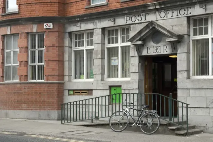 Framed Print : Europe, Ireland, Sligo. A bicycle parked in front of the post office. Credit as
