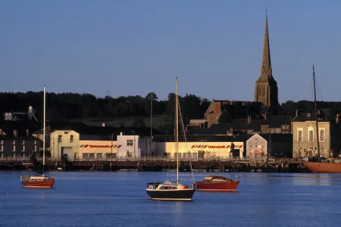 Framed Print : Europe, Ireland, Wexford. Late golden light plays off the boats and buildings on Wexford Harbor