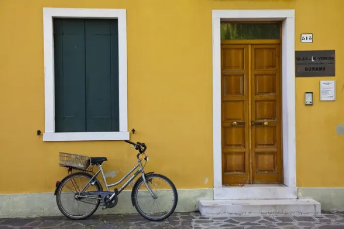 Framed Print : Europe; Italy; Burano; Bright Colored Homes Along the Canal with Bicycle
