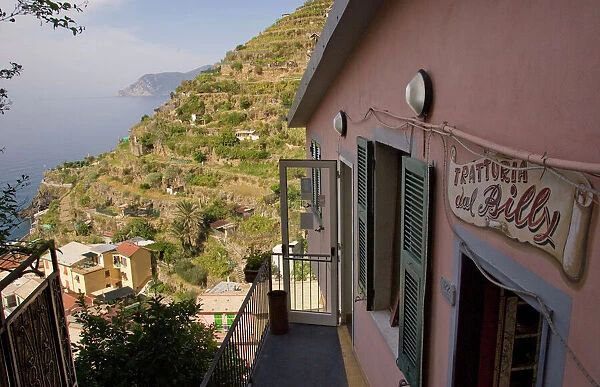 Europe, Italy, Cinque Terre, Manarola. Trattoria dal Billy restaurant looking over the coastline
