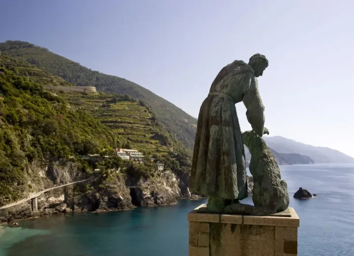 Framed Print : Europe, Italy, Cinque Terre, Monterosso. A statue of St. Francis of Assisi petting a dog Framed Print : Europe, Italy, Cinque Terre, Monterosso. A statue of St. Francis of Assisi petting a dog