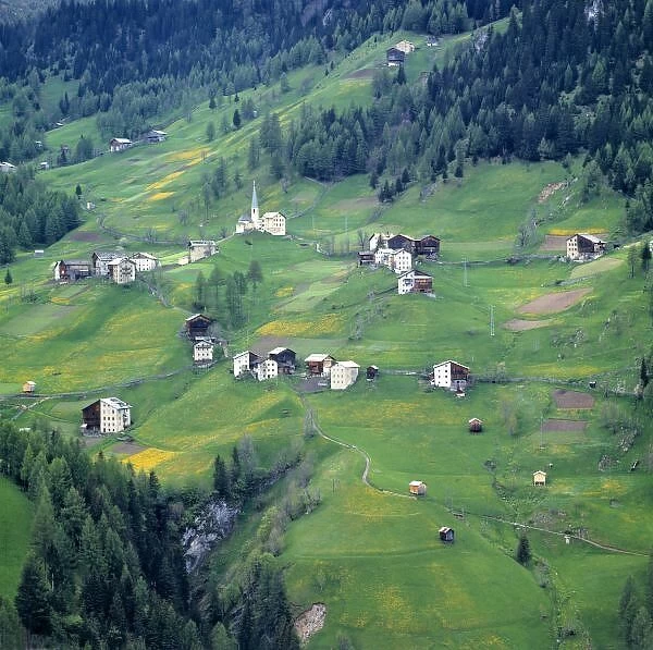 Europe, Italy, Dolomite Alps. This tiny village is perched on a hillside in the Dolomite Alps