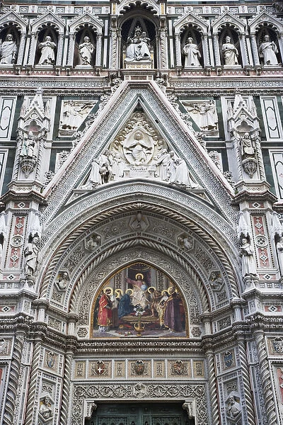 Europe, Italy, Florence. Carvings and artwork near the front entrance of the Duomo