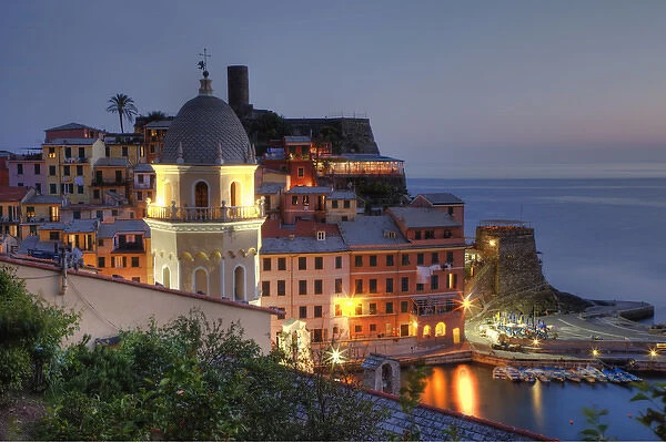 Europe, Italy, Liguria region, Cinque Terre. The hillside town of Vernazza in the evening