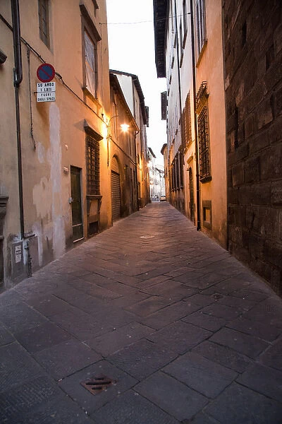 Europe; Italy; Lucca; Back Alley as evening Lights come