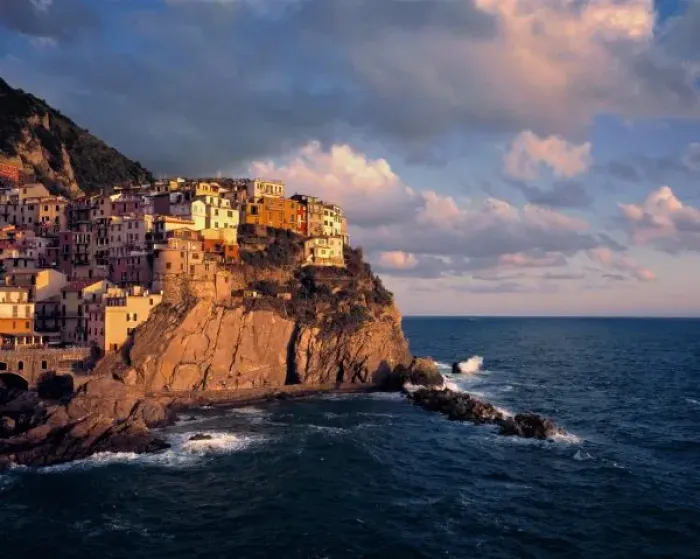 Framed Print : Europe, Italy, Manarola. The cliff-nestled houses of Manarola look over the waves