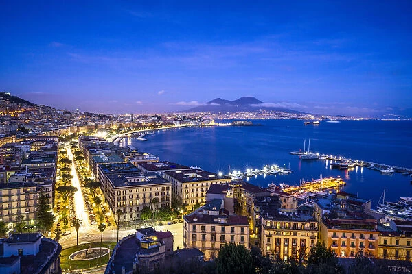 Europe, Italy, Naples. Overview of city with Mt. Vesuvius at sunset