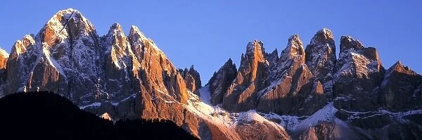 Europe, Italy, Odle Group. Late light accentuates the craggy peaks of the Odle Group