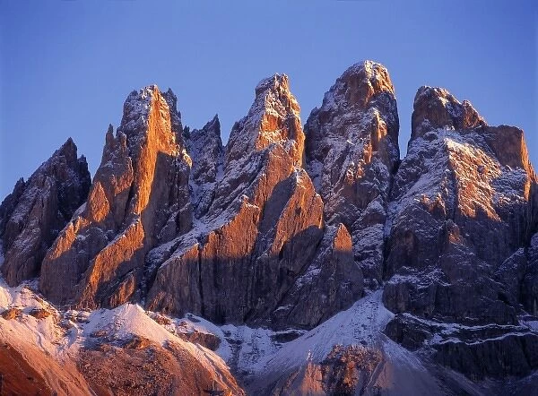 Europe, Italy, Odle Group. Late light rests on the craggy, snow-dusted peaks of the Odle Group