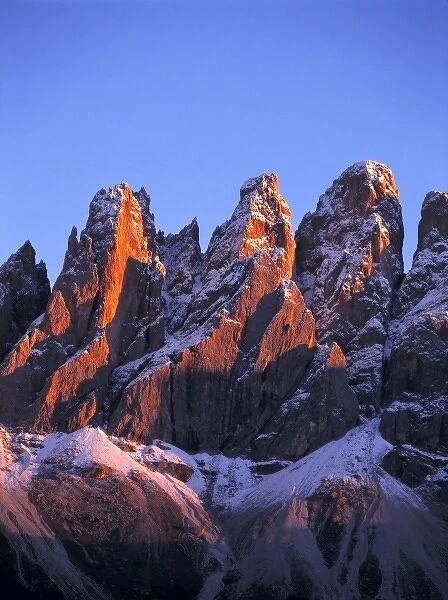 Europe, Italy, Odle Group. Red sunset light washes the craggy peaks of the Odle Group