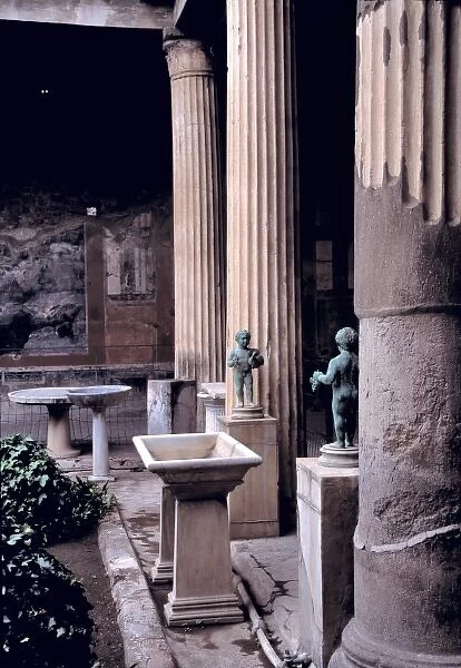 Europe, Italy, Pompeii. The garden at the House of the Vettii features bronze statuettes