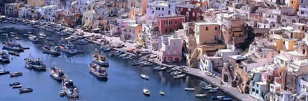 Europe, Italy, Procida. The homes and the boats are painted lively colors in Corricella