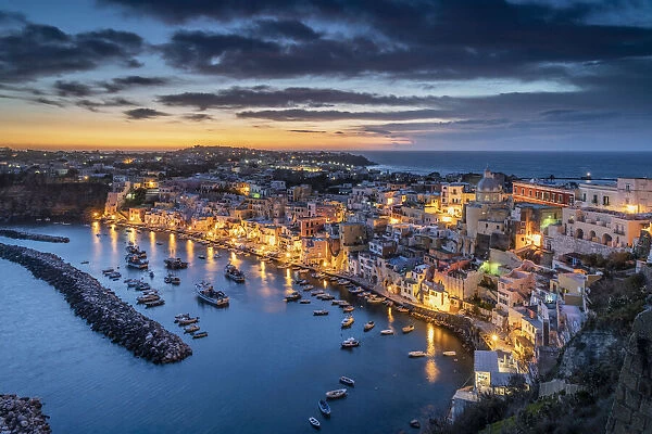 Europe, Italy, Procida. Overview of city and Marina Corricella at sunset