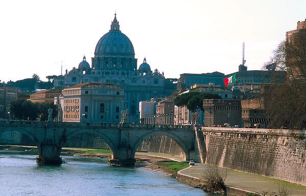 Europe, Italy, Rome. St. Peters Basilica looms over the Tiber River