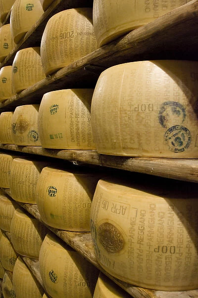 Europe, Italy, Ruberia. Shelves of aging Parmigiano-Reggiano cheese. Credit as: Wendy