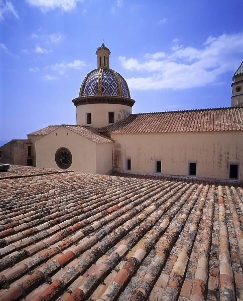 Europe, Italy, San Stefano. Roof tiles form a beautiful pattern on the church at
