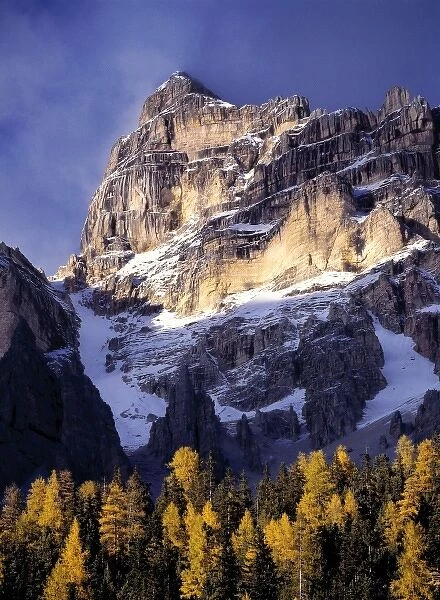 Europe, Italy, Sella Mountains. Sunlight washes a craggy peak near the Sella Group