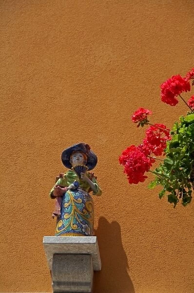Europe, Italy, Sicily, Taormina. Traditional pottery figurine wall decoration