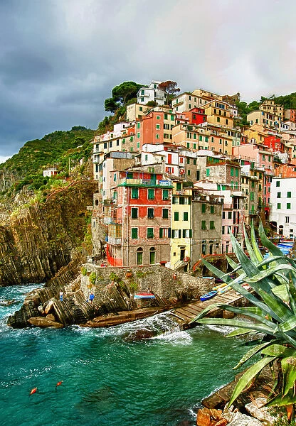 Europe, Italy, Tuscany, Cinque Terre. The stunning shoreline of Riomaggiore in Cinque