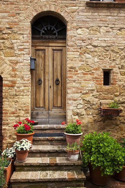 Europe; Italy; Tuscany; Pienza; Doorway withFlowers Around them