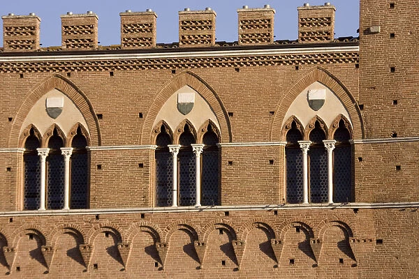 Europe, Italy, Tuscany, Sienna. Three windows on Torre del Mangia medieval building