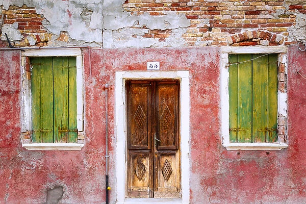 Europe, Italy, Veneto, Burano. Weathered house exterior