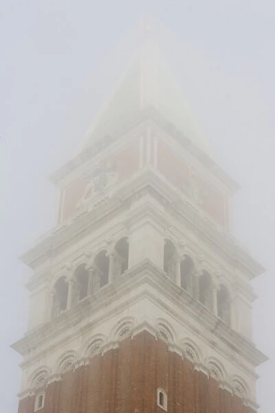 Europe, Italy, Venice. The top of Campanile in early morning fog